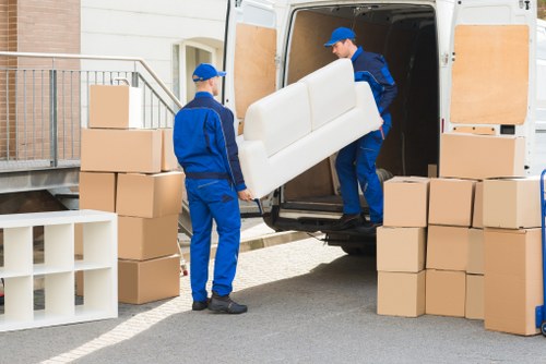Careful packing of fragile items for flat removals in Preston