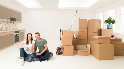 Household removals team handling furniture during a Preston move