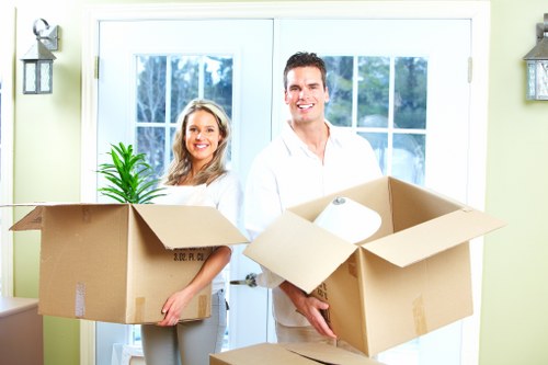 Professional movers packing and loading furniture for storage