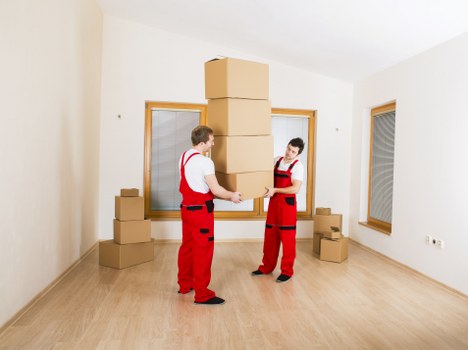 Organised boxes and furniture inside a mobile storage unit
